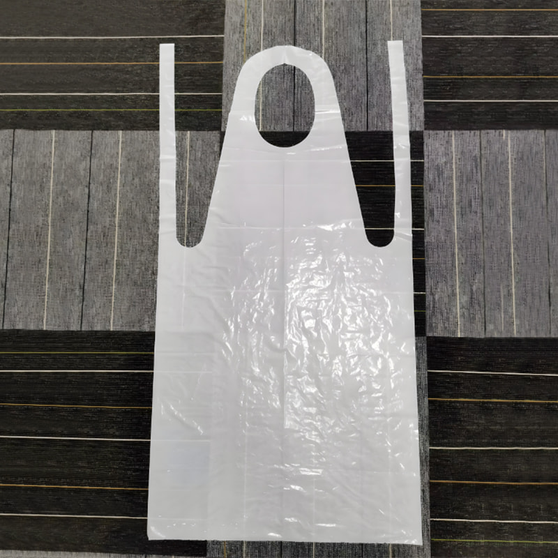 Apron PE putih berkrim